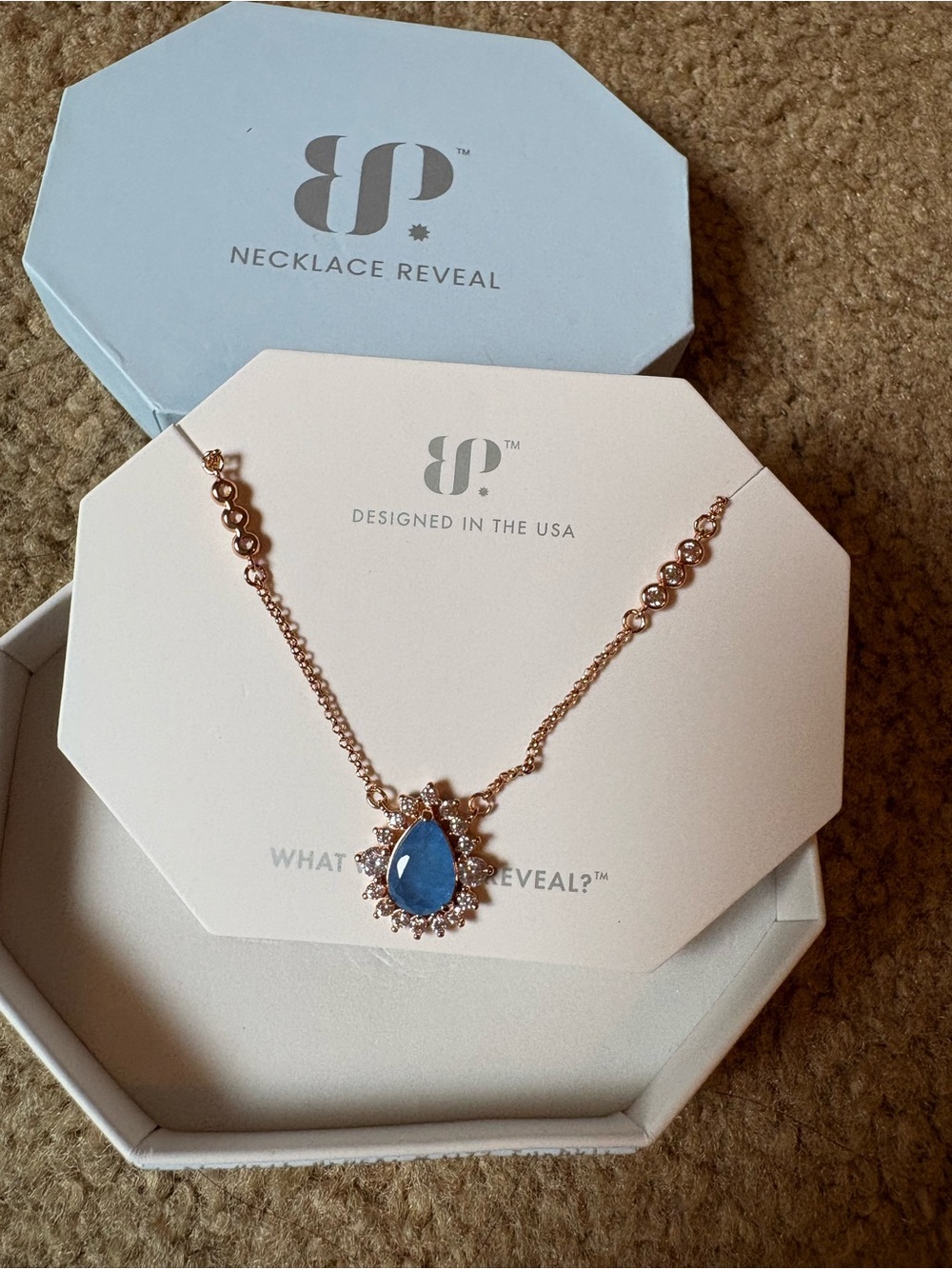 Rose Gold Necklace with Blue Teardrop Pendant and Halo Accents